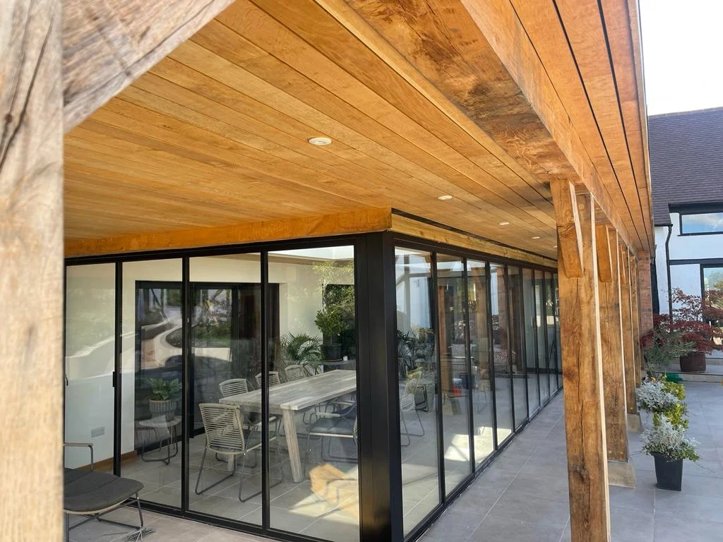 black l shaped bifold doors